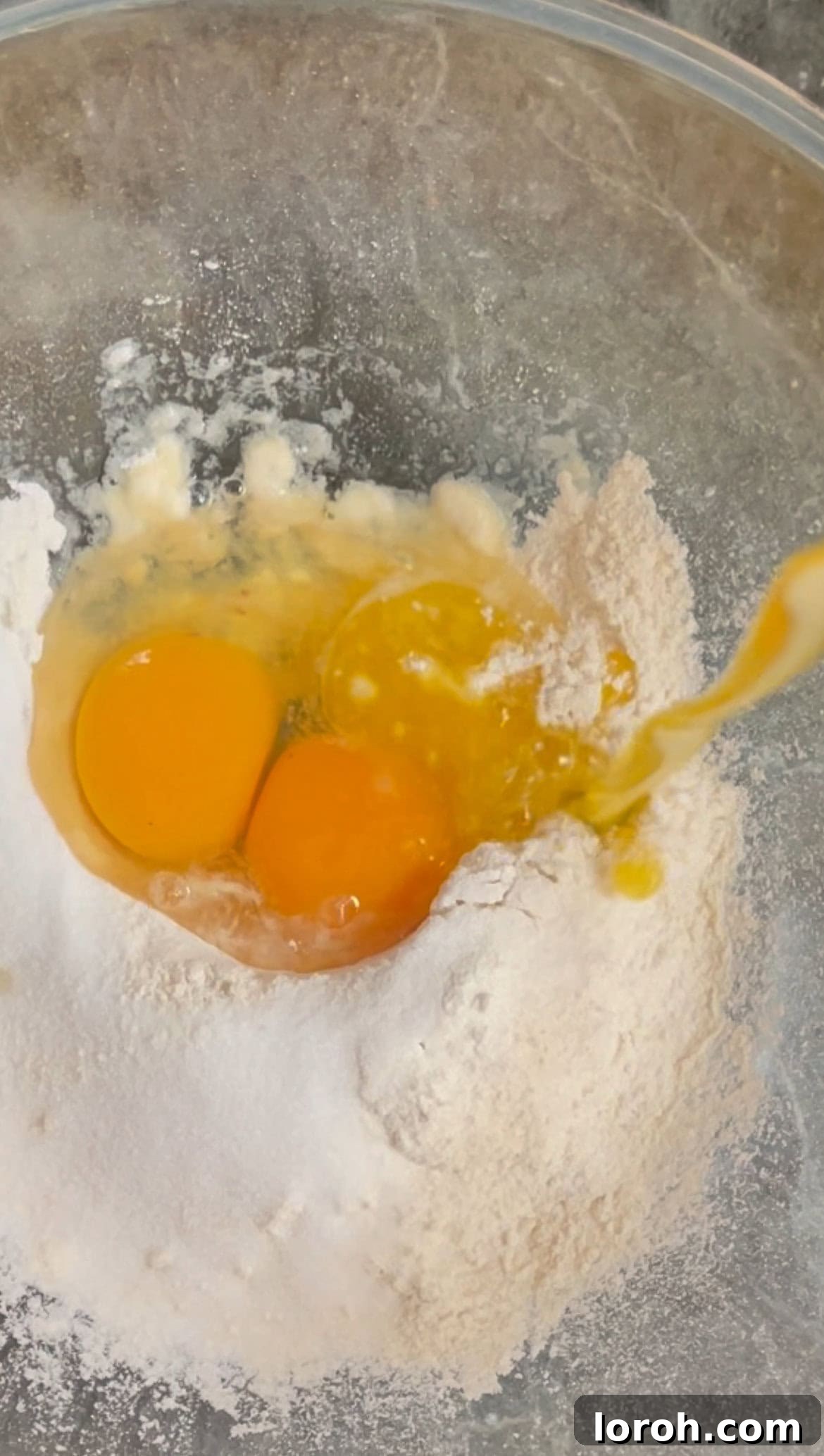 mixing pancake batter in a bowl.