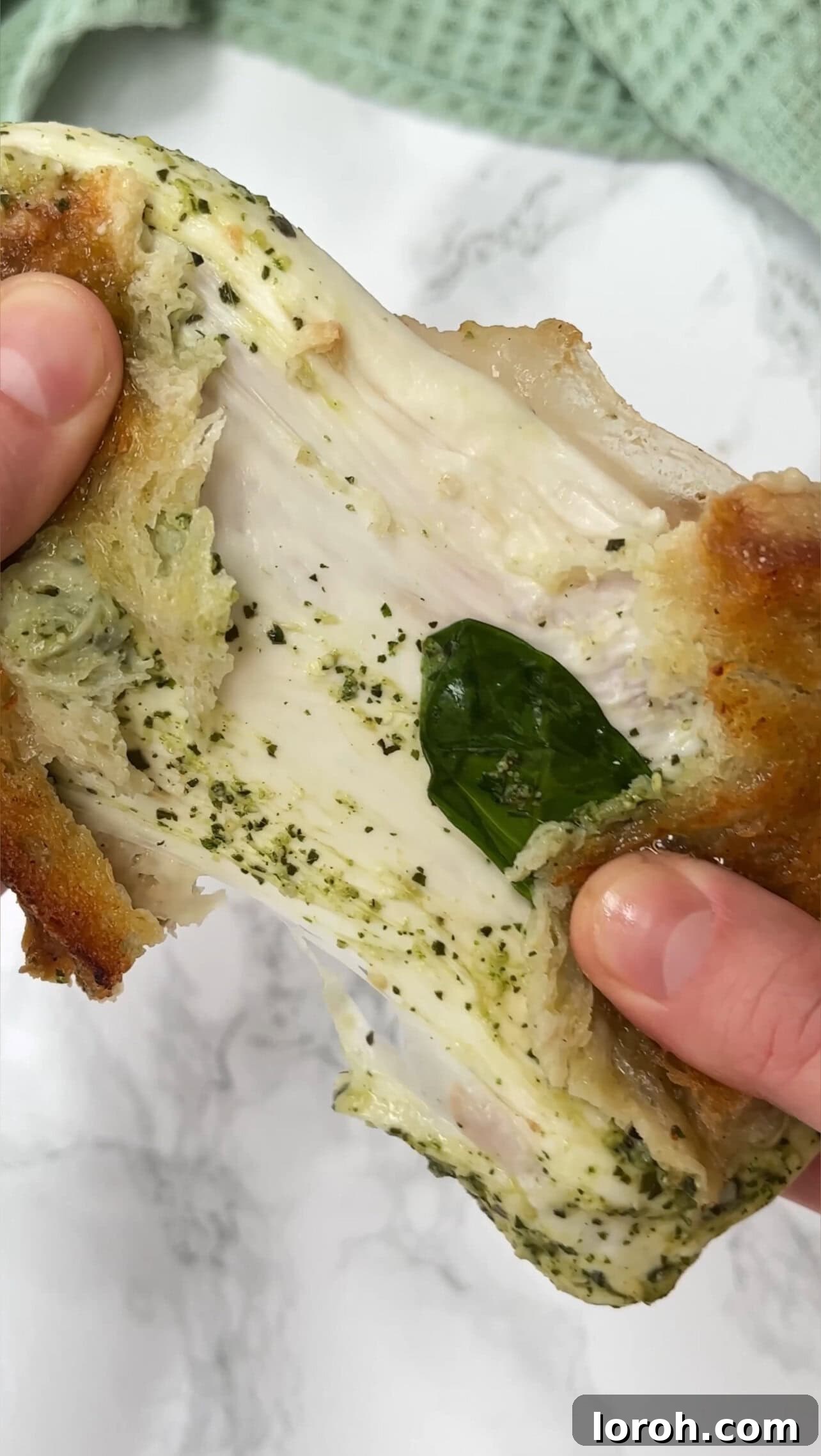 Close-up of Stanley Tucci's sandwich being prepared, highlighting the layers of prosciutto and mozzarella
