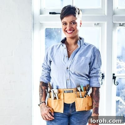 Jack Monroe smiling warmly, a captivating and inspiring figure.