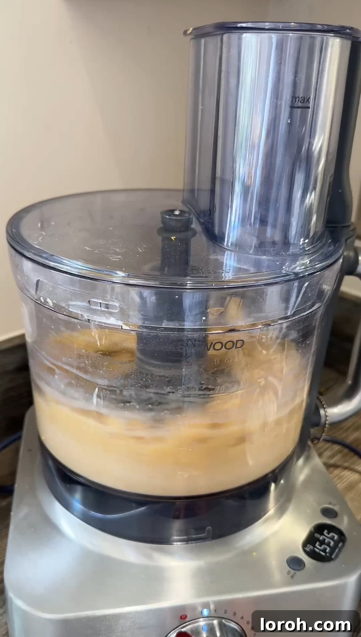 Sunshine Lemon Loaf 7 The food processor actively blending the cake batter into a smooth consistency.