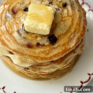 a stack of pancakes with no baking powder on a white plate