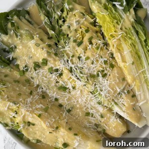 Creamy Tahini Parmesan Salad Dressing in a jar, ready to be served