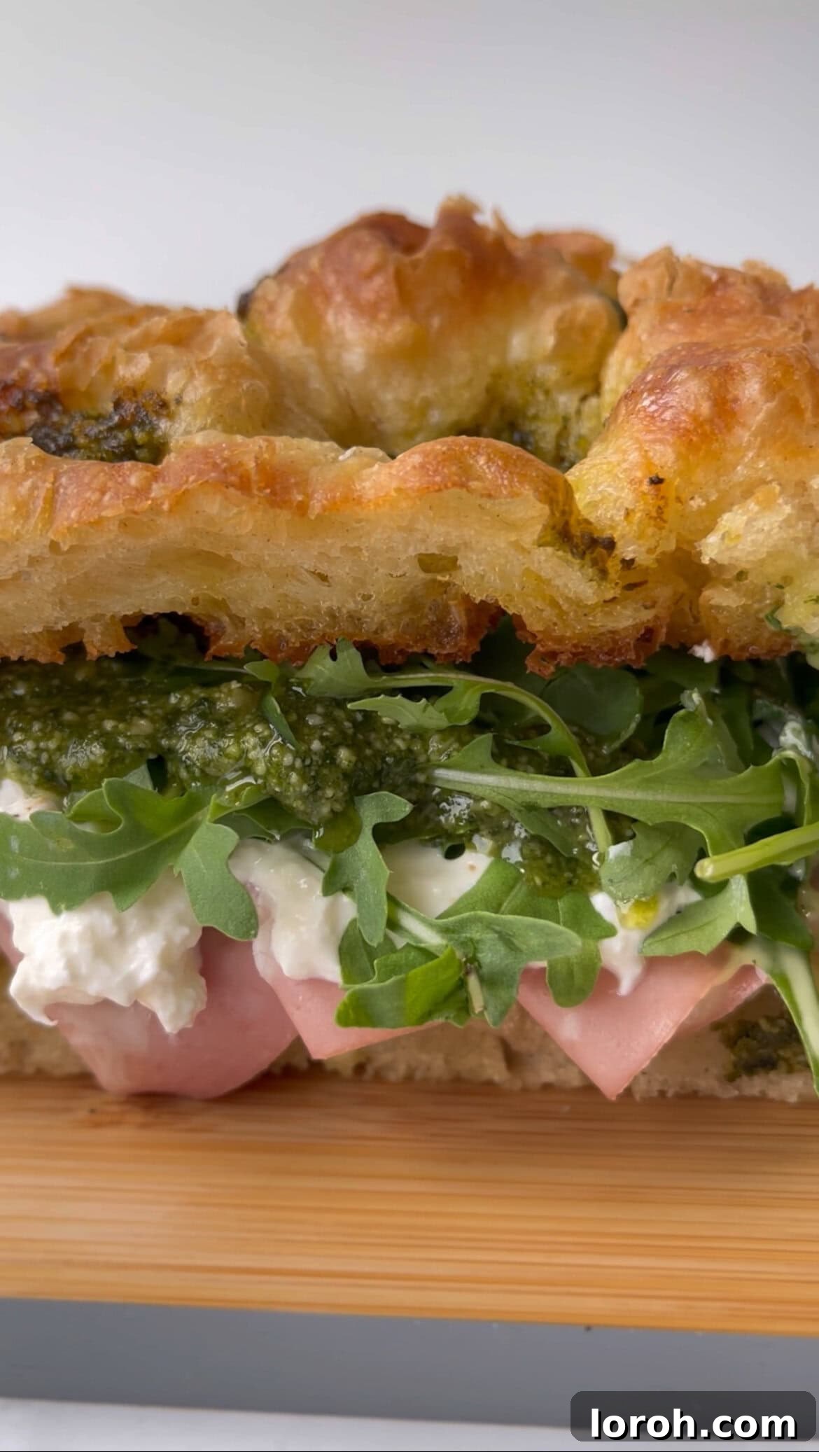 mortadella burrata sandwich side angle, showing layers