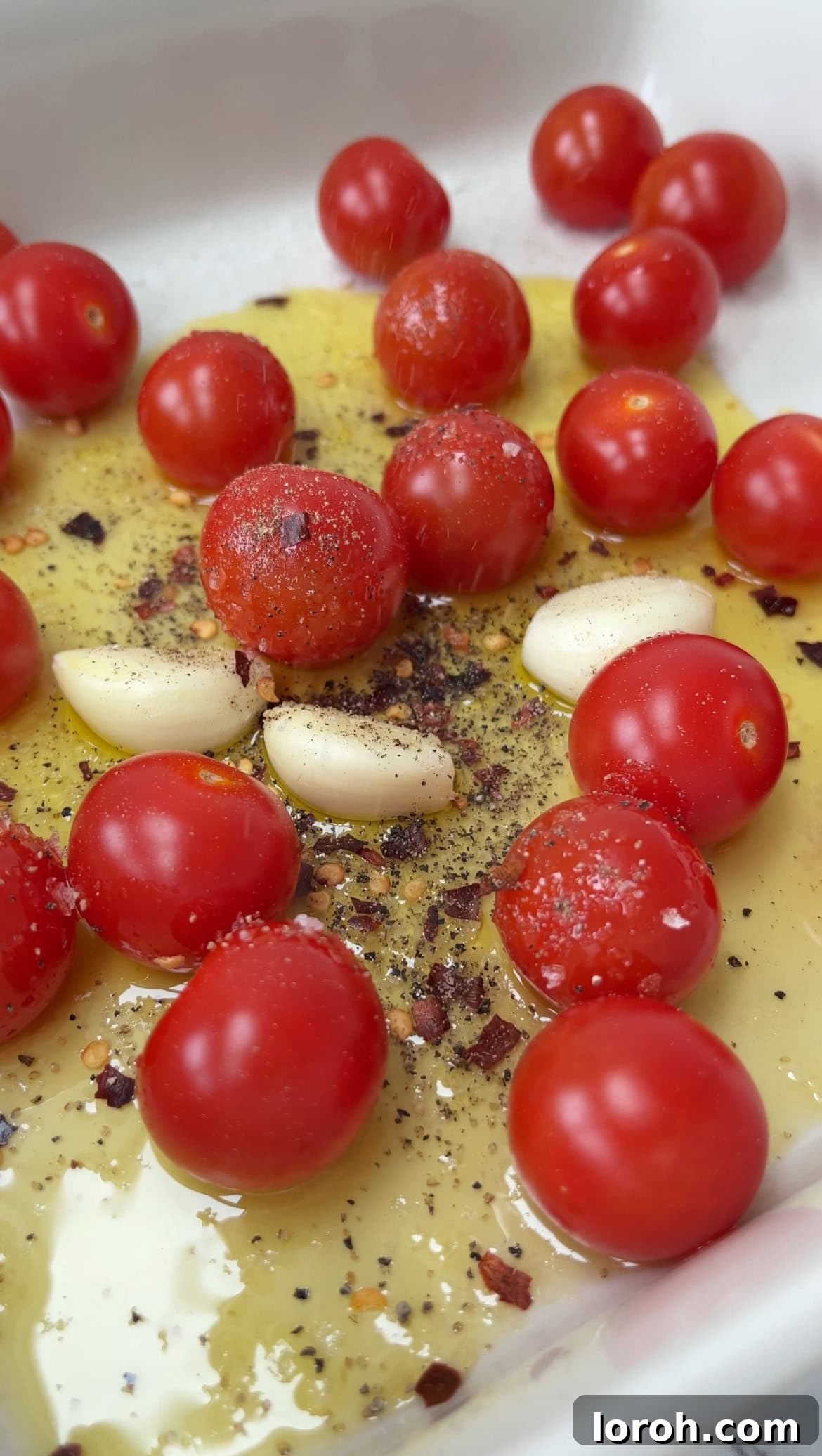 Velvety Tomato Mascarpone Orzo 4 roasting cherry tomatoes and garlic with olive oil and spices.