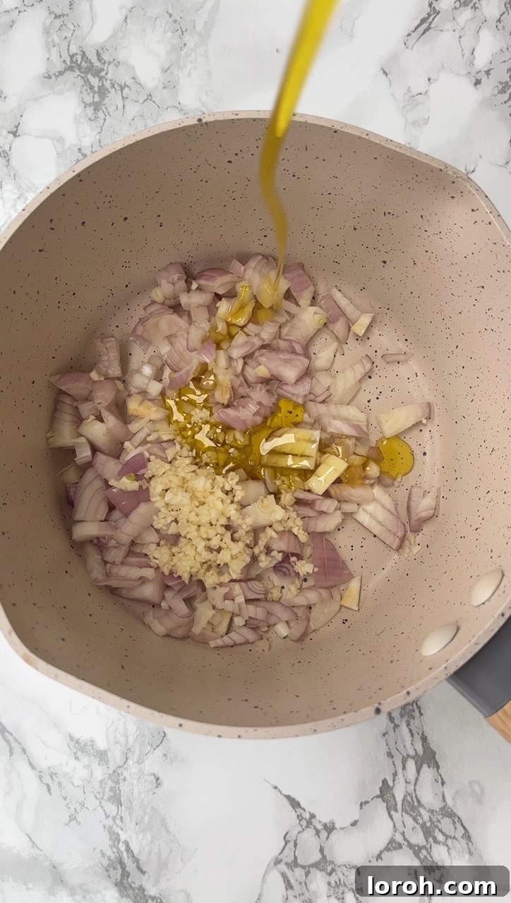 Crispy Chicken Parm Hero 3 Sautéing onions for tomato sauce