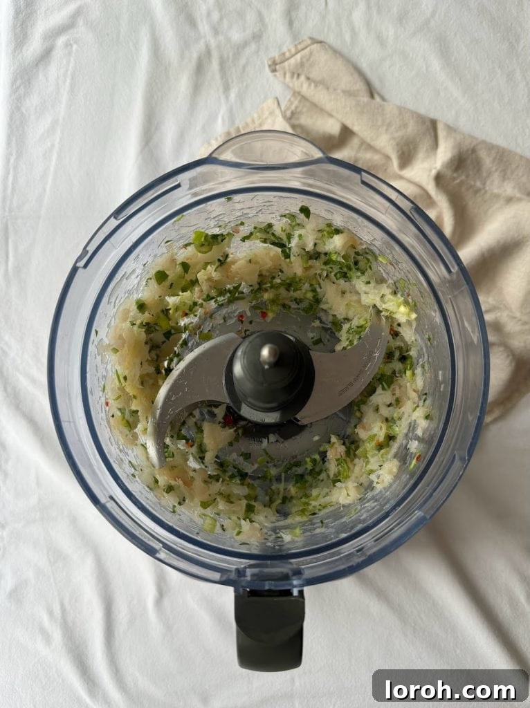 Blitzed fish cake ingredients in a food processor.