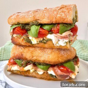 Gourmet Burrata Caprese Sandwich with Prosciutto and Pistachio Pesto