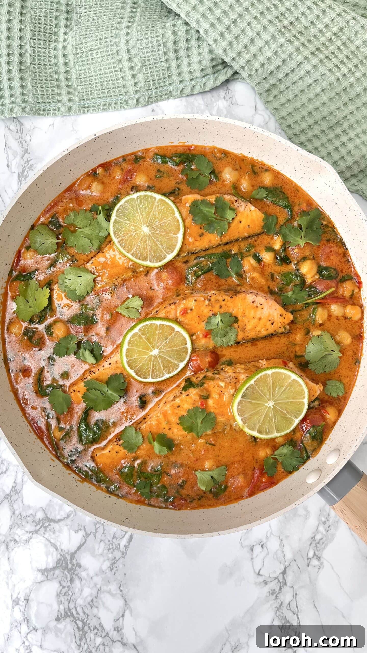 A vibrant, delicious One-Pan Thai Salmon Curry served in a pan with fresh ingredients.