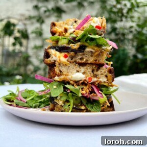 Crispy Miso Caramel Aubergine Sandwich with Sour Cream, Chilli, Pickled Red Onion and Rocket on Sourdough Bread