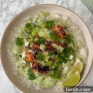 Crispy Hot Honey and Sesame Salmon with fragrant Coconut Rice, a refreshing Cucumber Avocado Salad, and creamy Coriander Dressing