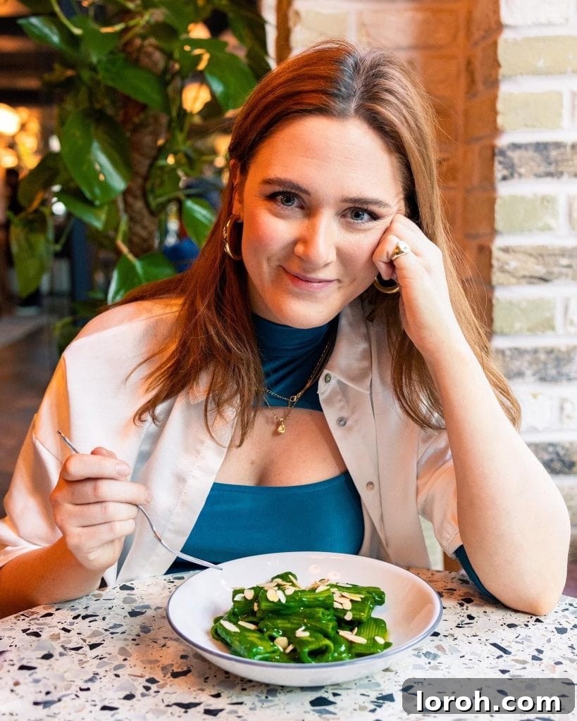 Rosie Mackean, a celebrated chef and food stylist, smiling warmly, ready to share her dinner party secrets and culinary expertise.