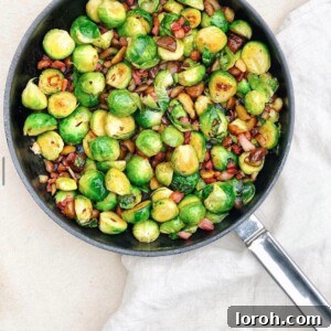 Brussel sprouts, chopped chestnuts and bacon in a silver pan