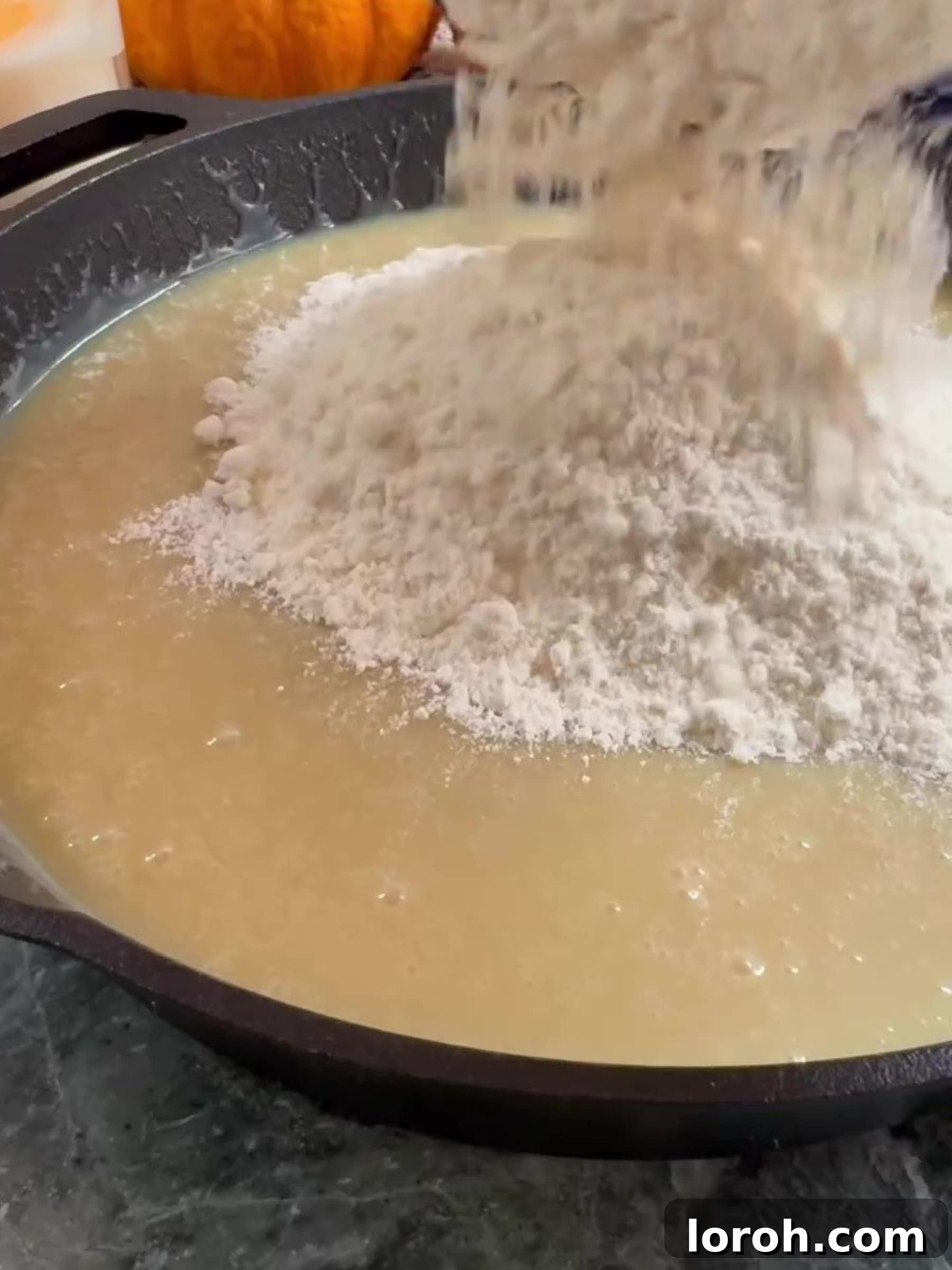 Effortless Condensed Milk Cookie Bars 7 Adding flour and baking powder to the wet mixture
