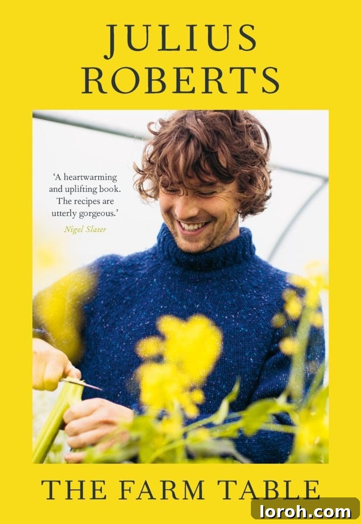 Julius Roberts smiling with flowers in the forefront on a book cover
