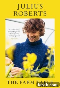 Julius Roberts smiling with flowers in the forefront on a book cover