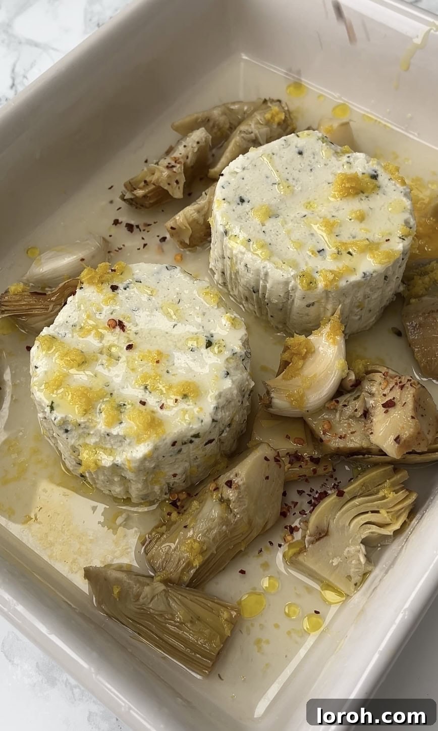 Creamy Lemon Artichoke Boursin Pasta Bake 6 A baking tray filled with Boursin cheese, lemon zest, artichokes, and chili flakes, ready to be baked.