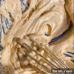 whipped brown butter in a bowl with a spoon