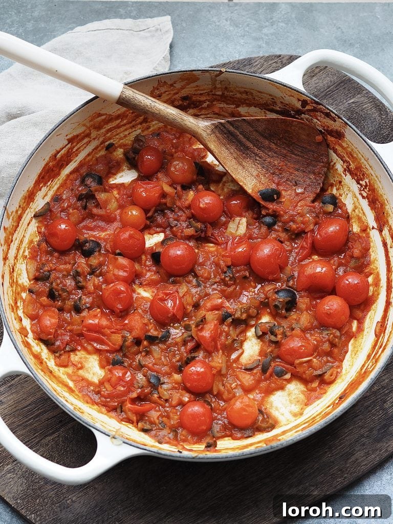 Bold Penne Puttanesca 7 Stirring vibrant cherry tomatoes into a pan of sautéed onions, anchovies, olives, and capers, forming the rich sauce.