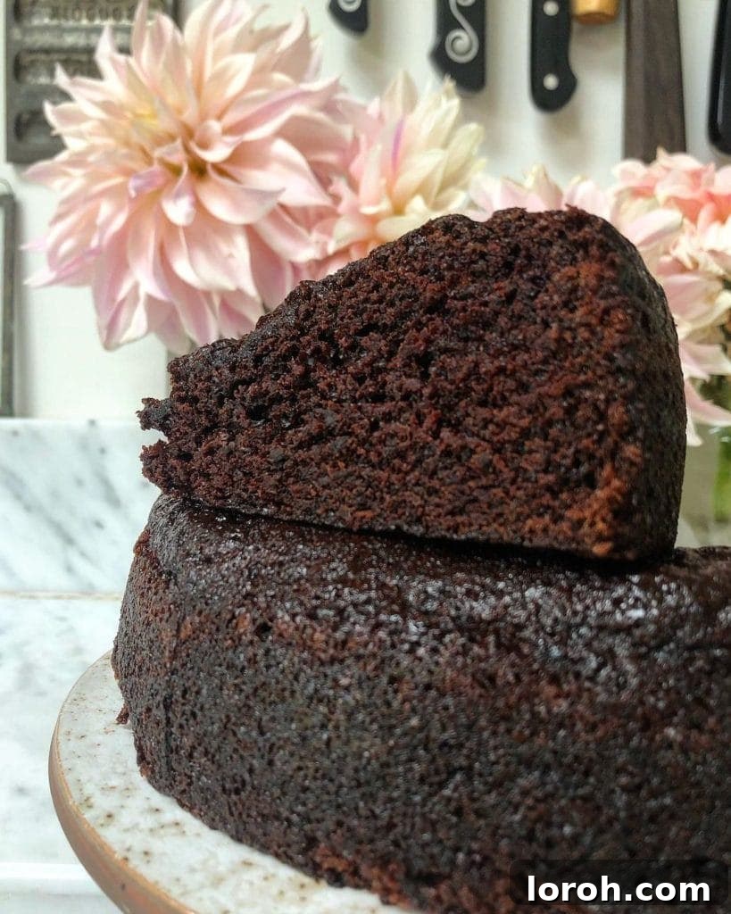 Simply Decadent Chocolate Cake 3 A perfectly cut slice of the moist chocolate cake, revealing its rich, dark crumb and delightful texture.