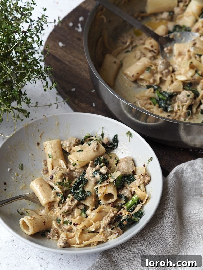 Chili-Fennel Sausage Rigatoni with Tuscan Kale 8 Half eaten bowl of sausage rigatoni next to the cooking pot it was served from.
