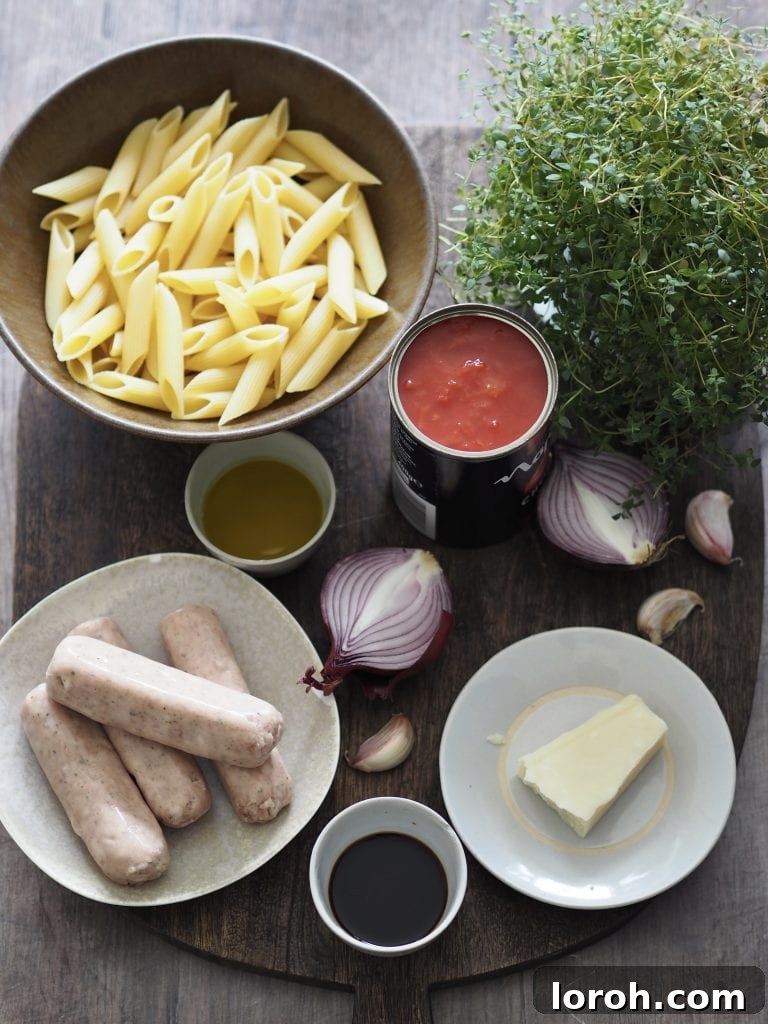 Hearty Weeknight Sausage Ragu 4 A rustic wooden board displaying fresh ingredients for sausage ragu: vibrant red onions, garlic cloves, fresh thyme, and quality pork sausages.