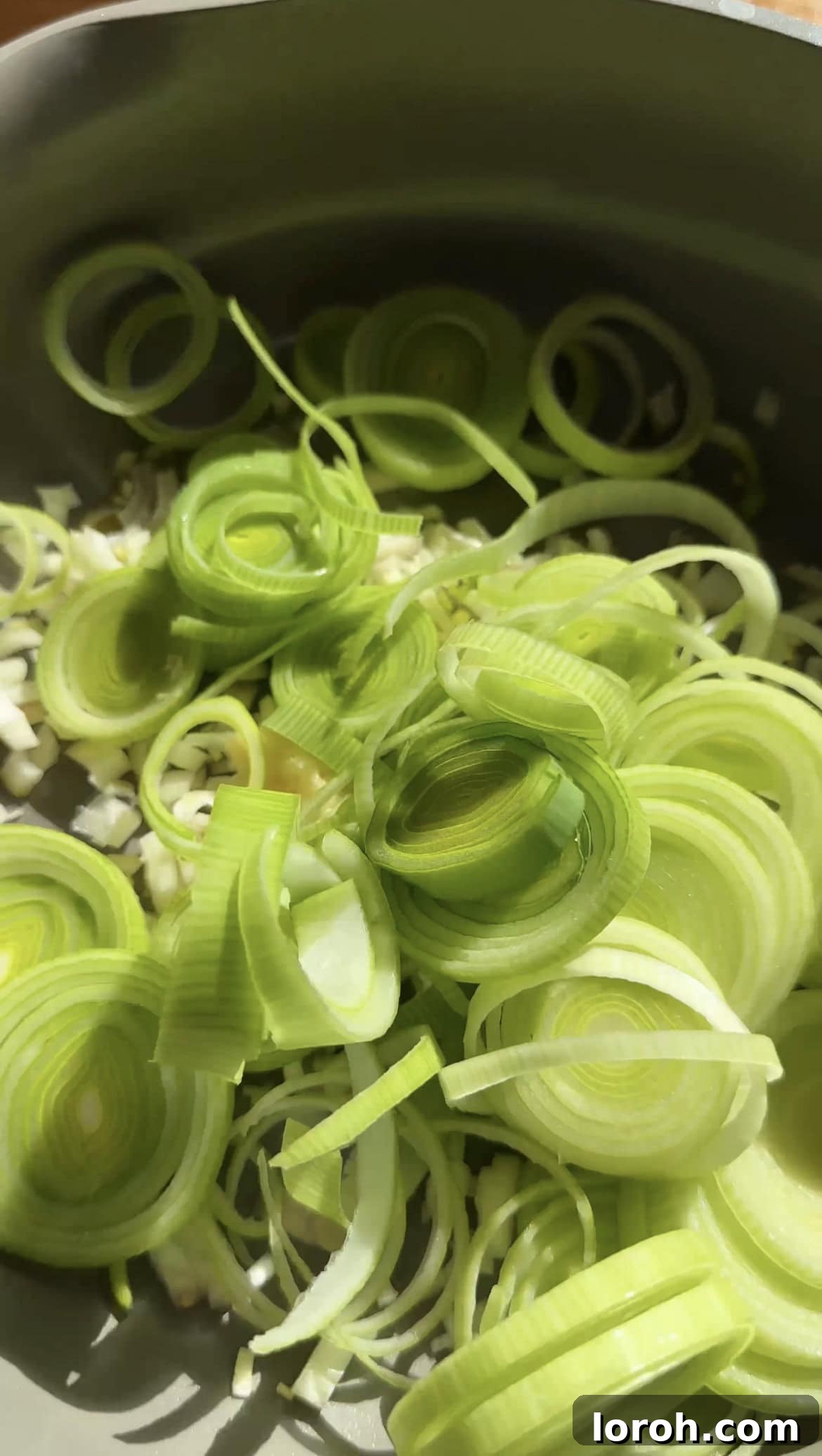 Sizzling Parma Ham & Leek One-Pan Pasta 3 Sliced leeks, garlic, spring onions, and shallots sautéing in olive oil in a large pan