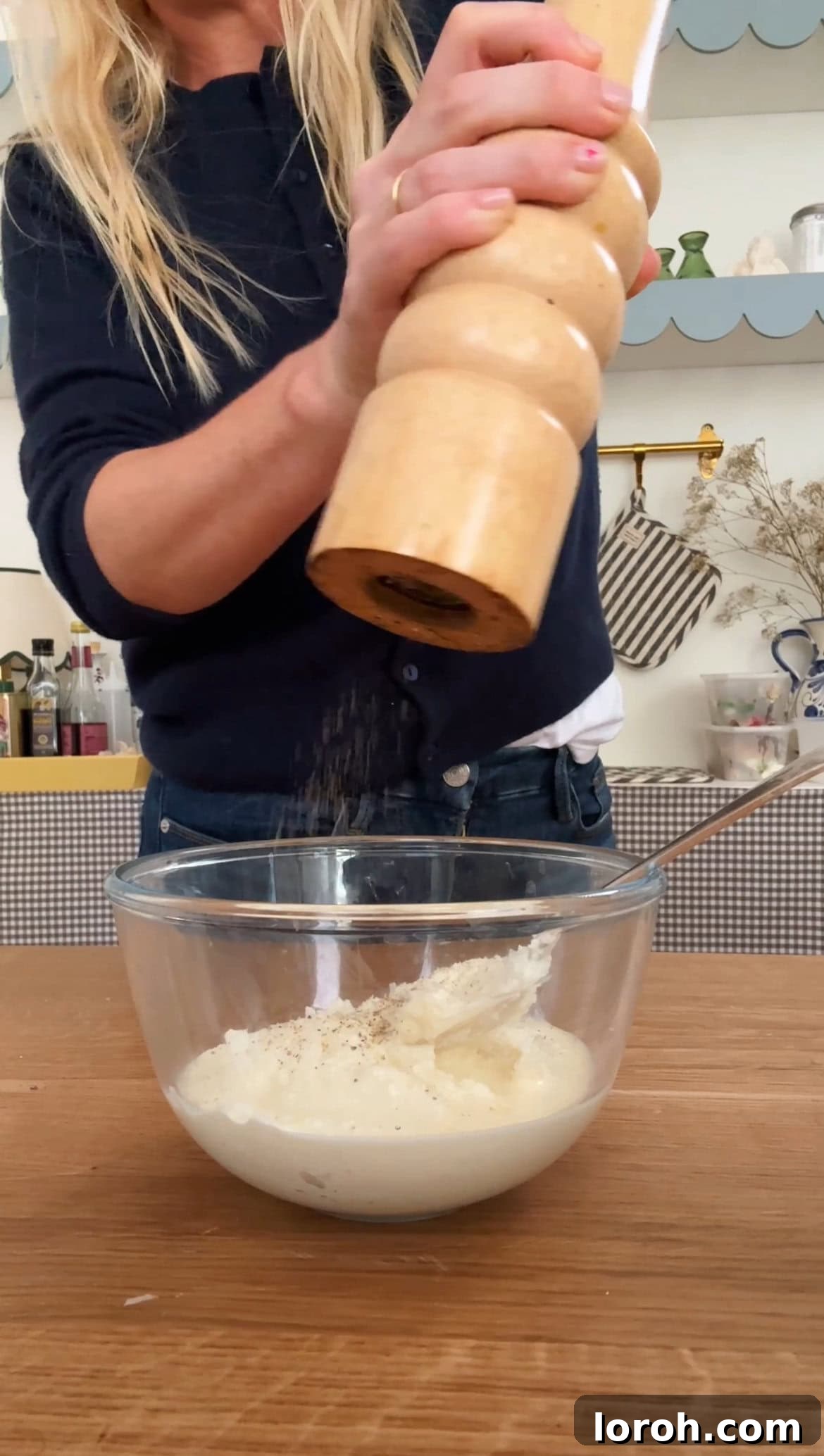 Mixing ricotta cheese and double cream in a bowl, seasoning with salt and pepper.