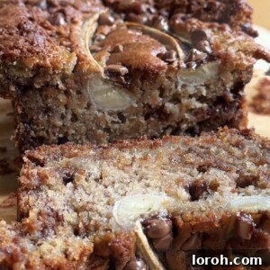 Moist chocolate chip banana bread slices, a perfect visual of the finished dessert.