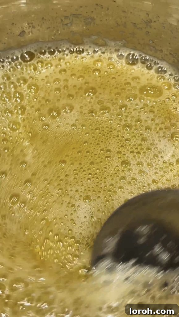 Step 2: Butter foaming and bubbling in the pan, indicating the start of the browning process.
