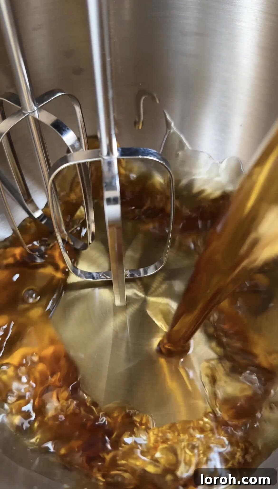 Step 4: Pouring cooled brown butter into a mixing bowl, ready for the banana bread batter.