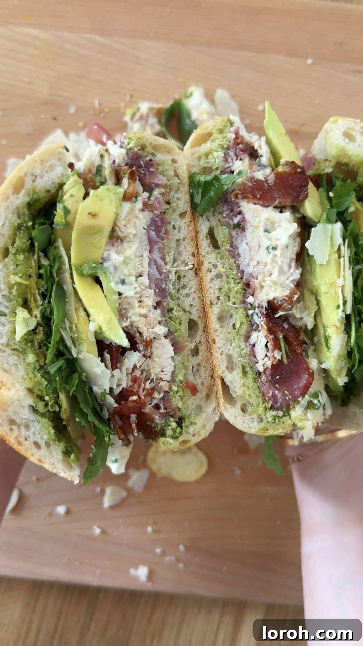 A cross-section view of the chicken mayonnaise sandwich, showing all the juicy layers and textures.