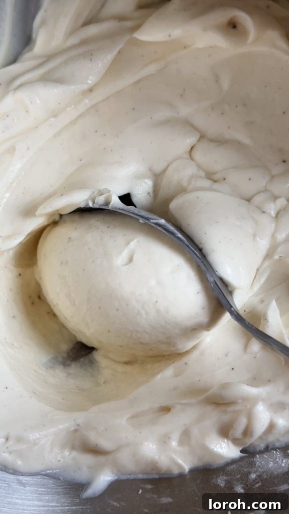 Close-up of the smooth, whipped texture of mascarpone icing for tiramisu cookies