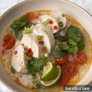 Thai Chicken Soup With Rice in a beige bowl