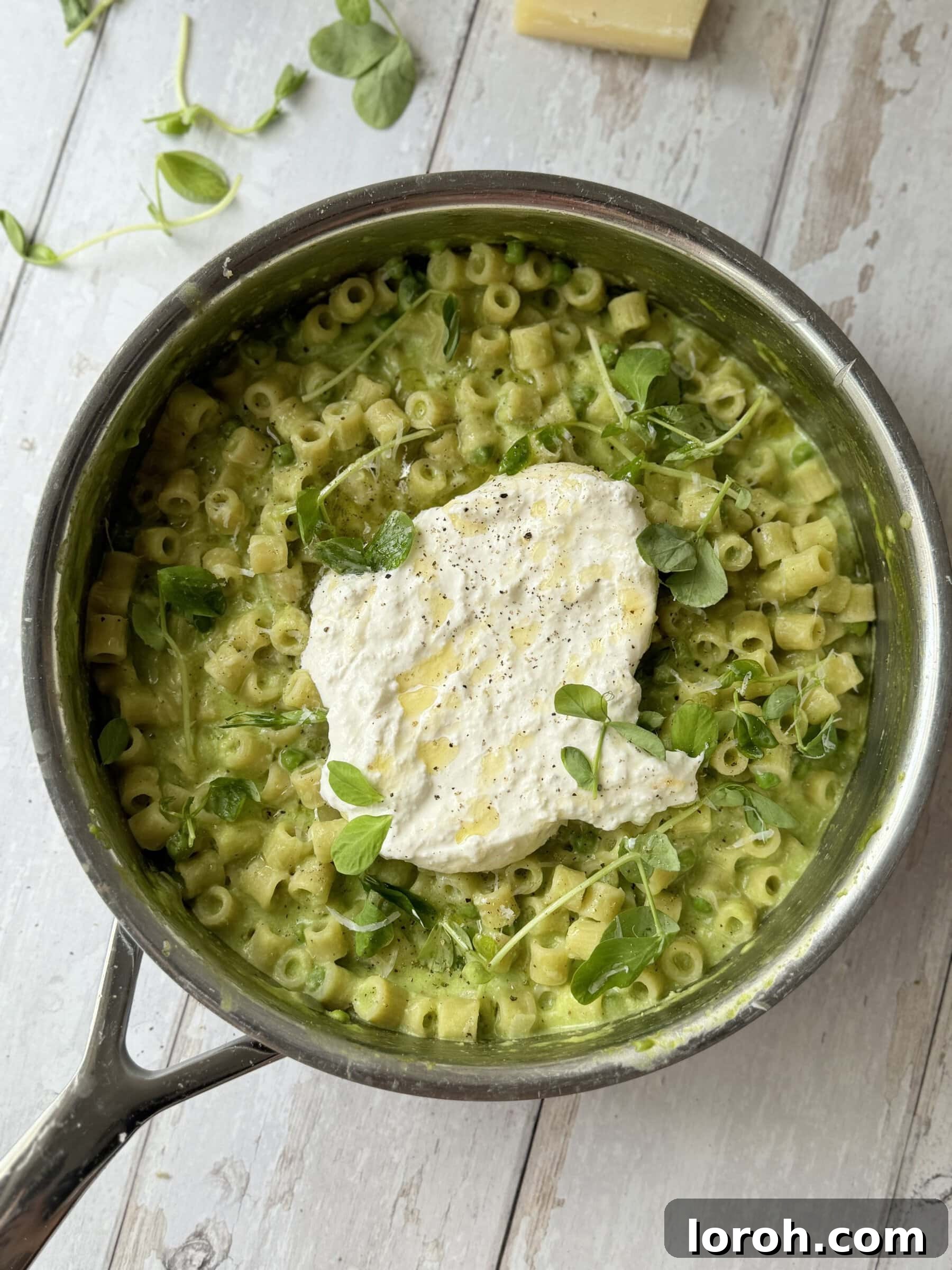 One Pan Pasta and Peas in a serving bowl, garnished and ready to eat.