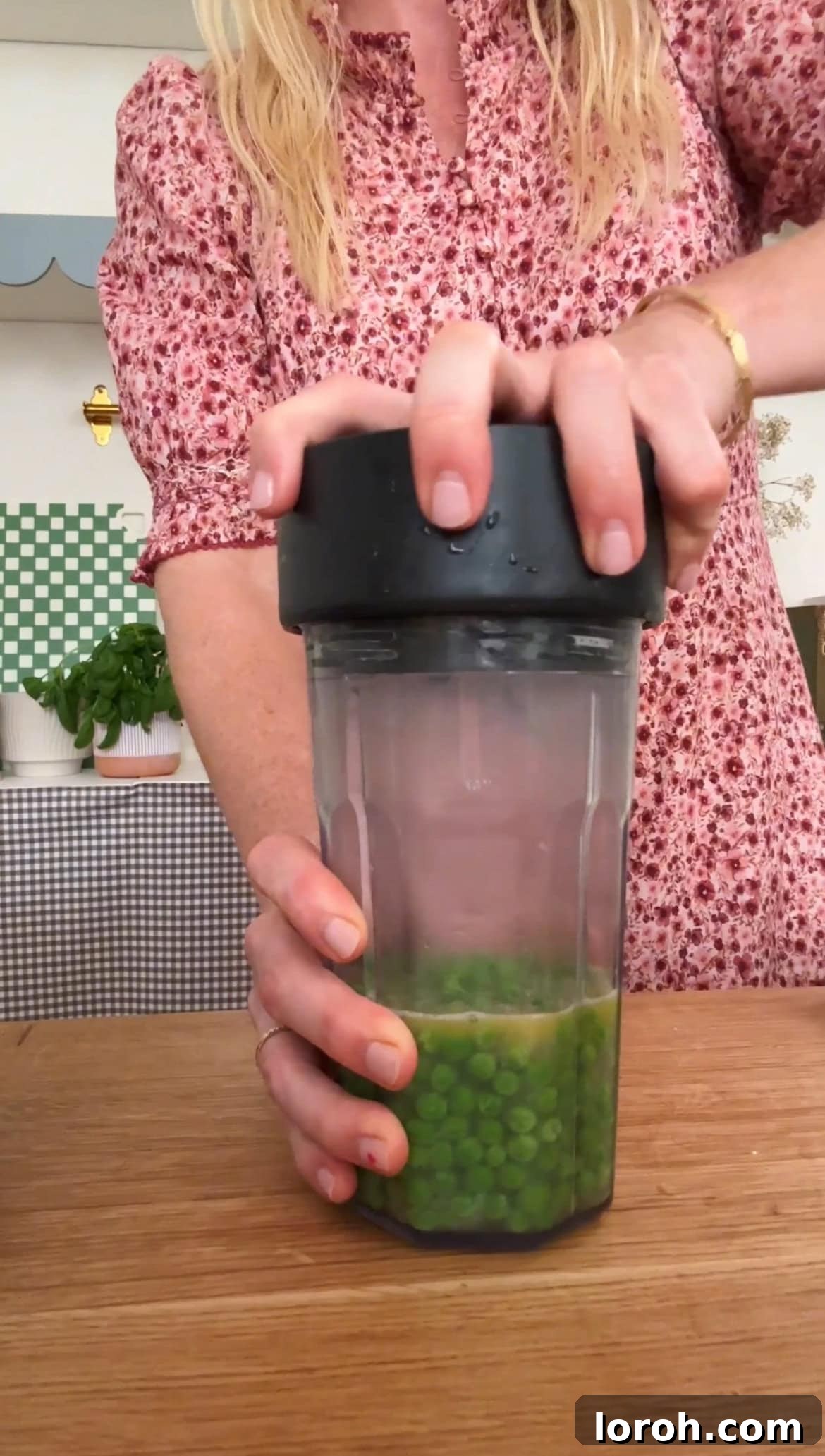 Blending a portion of the cooked pea mixture until smooth.