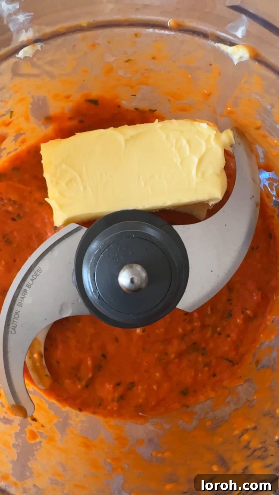 Tomato Butter: The Secret to Everything Delicious 7 Roasted tomato and basil paste in a food processor, with softened butter added, ready for the final blend.