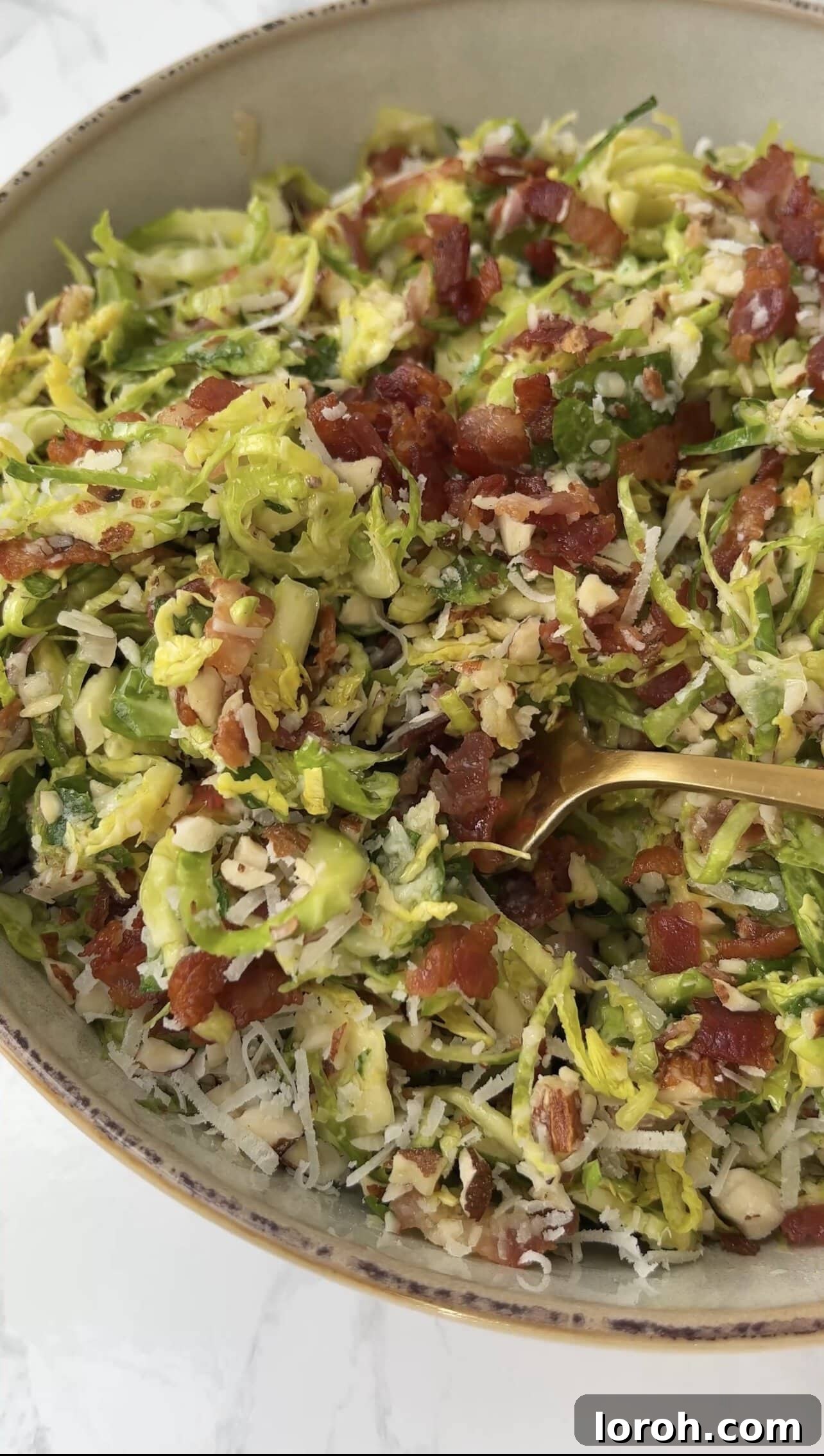 Delicious shaved Brussels sprouts salad with crispy bacon bits, ready to be served