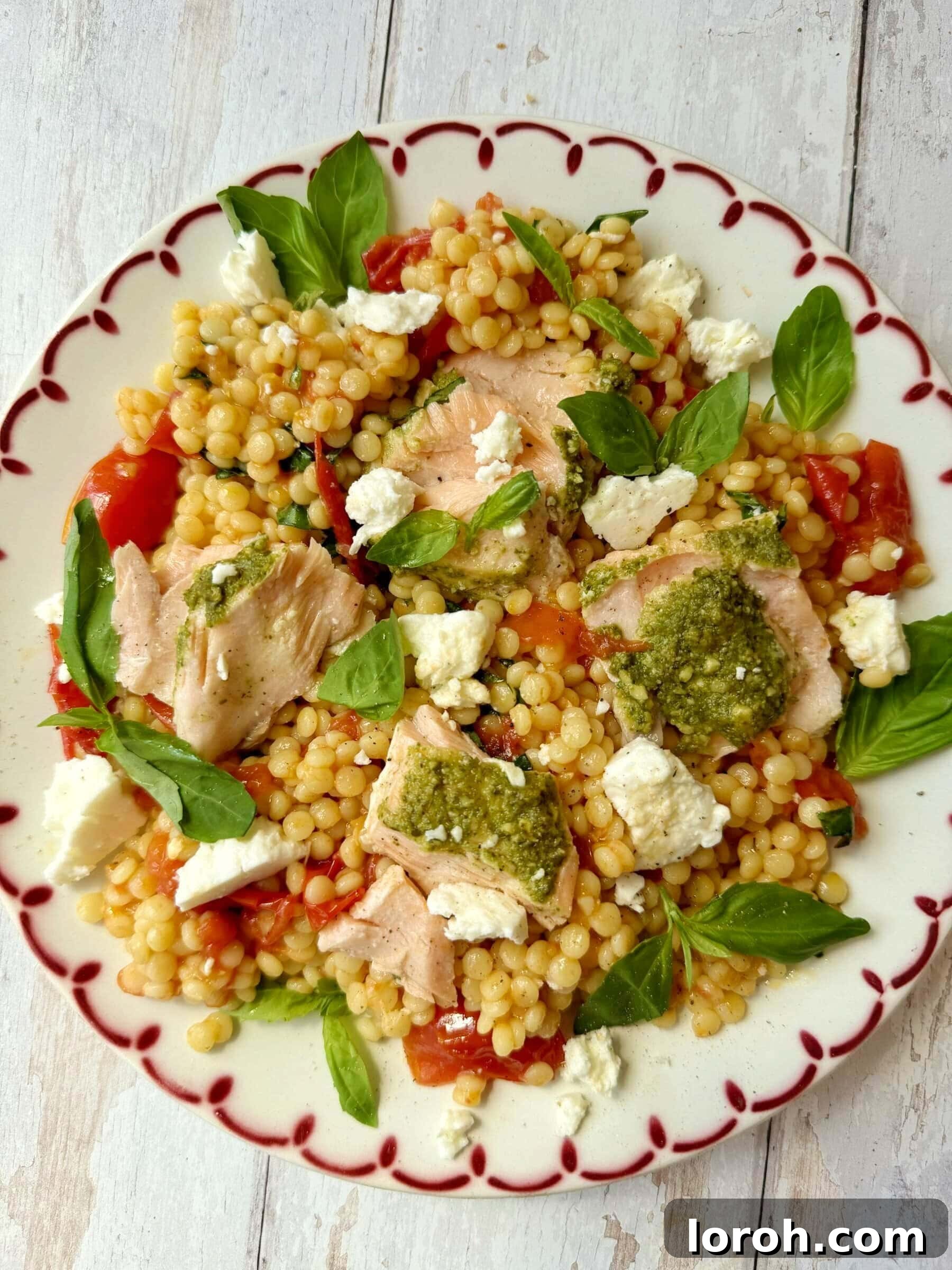 Pesto Crusted Salmon with Roasted Tomato Giant Couscous Salad, a healthy and quick dinner idea.