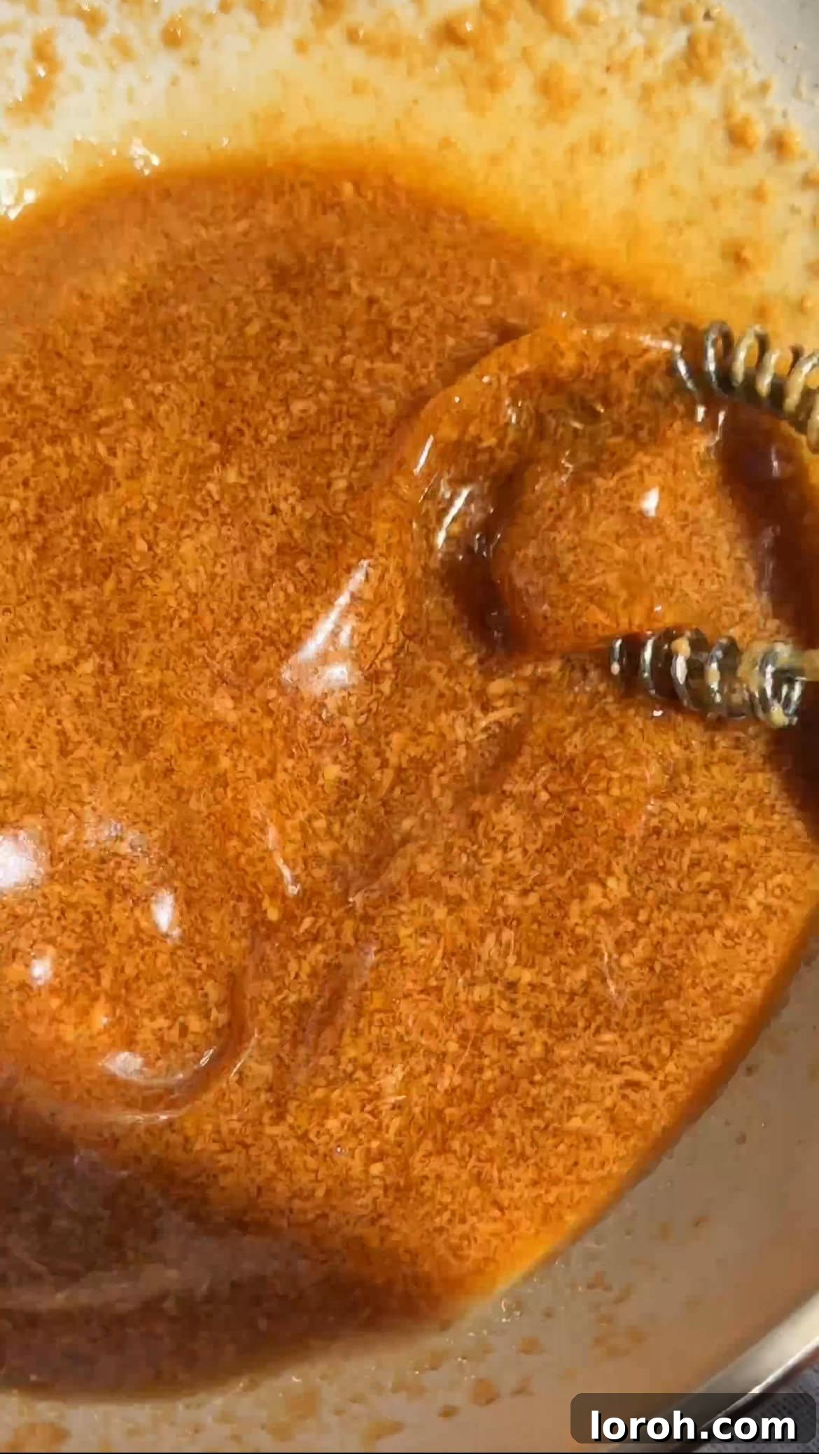 Whisking the Pad Thai sauce until smooth and well-combined.
