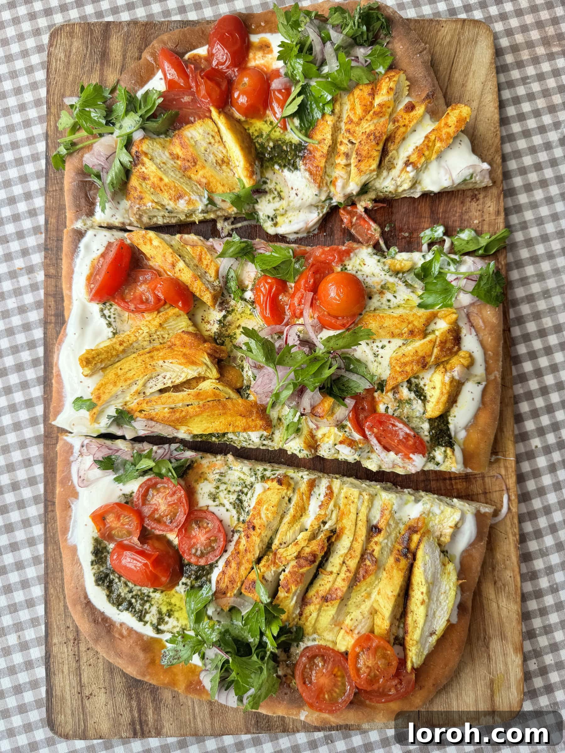 chicken flatbread on wooden board into slices