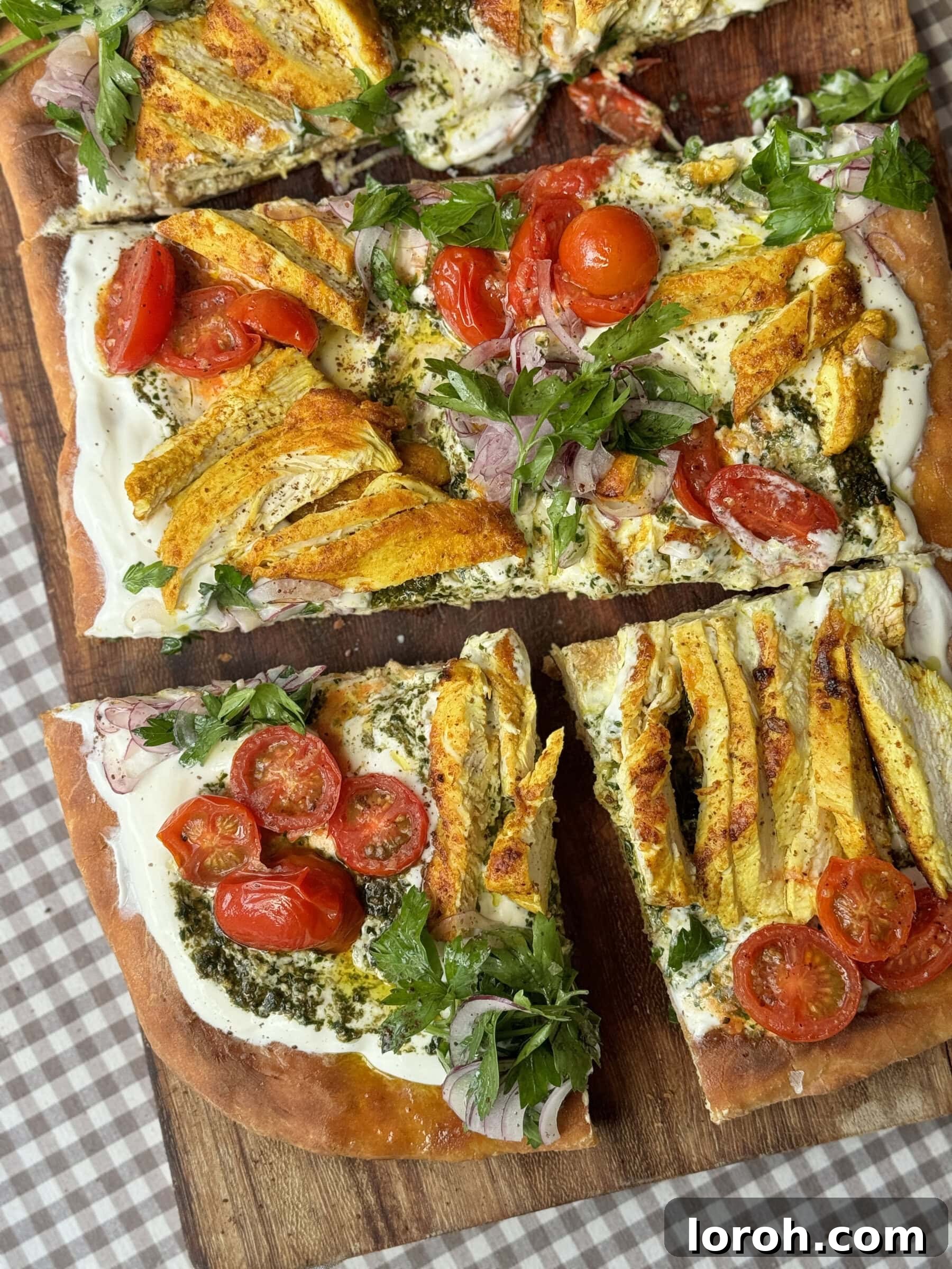 chicken flatbread on wooden board into slices