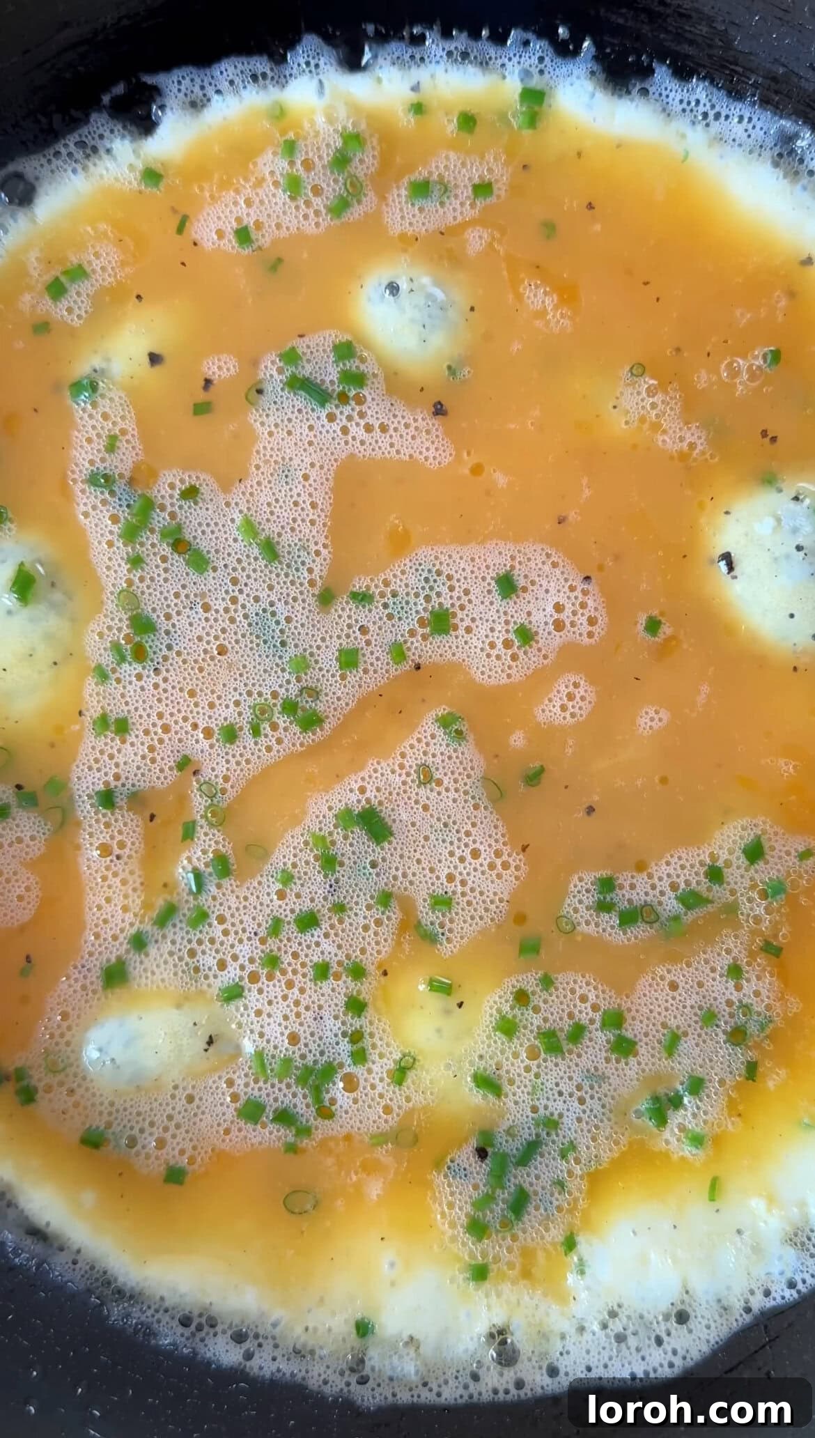 Step three: Adding beaten eggs to the foaming butter in the pan.
