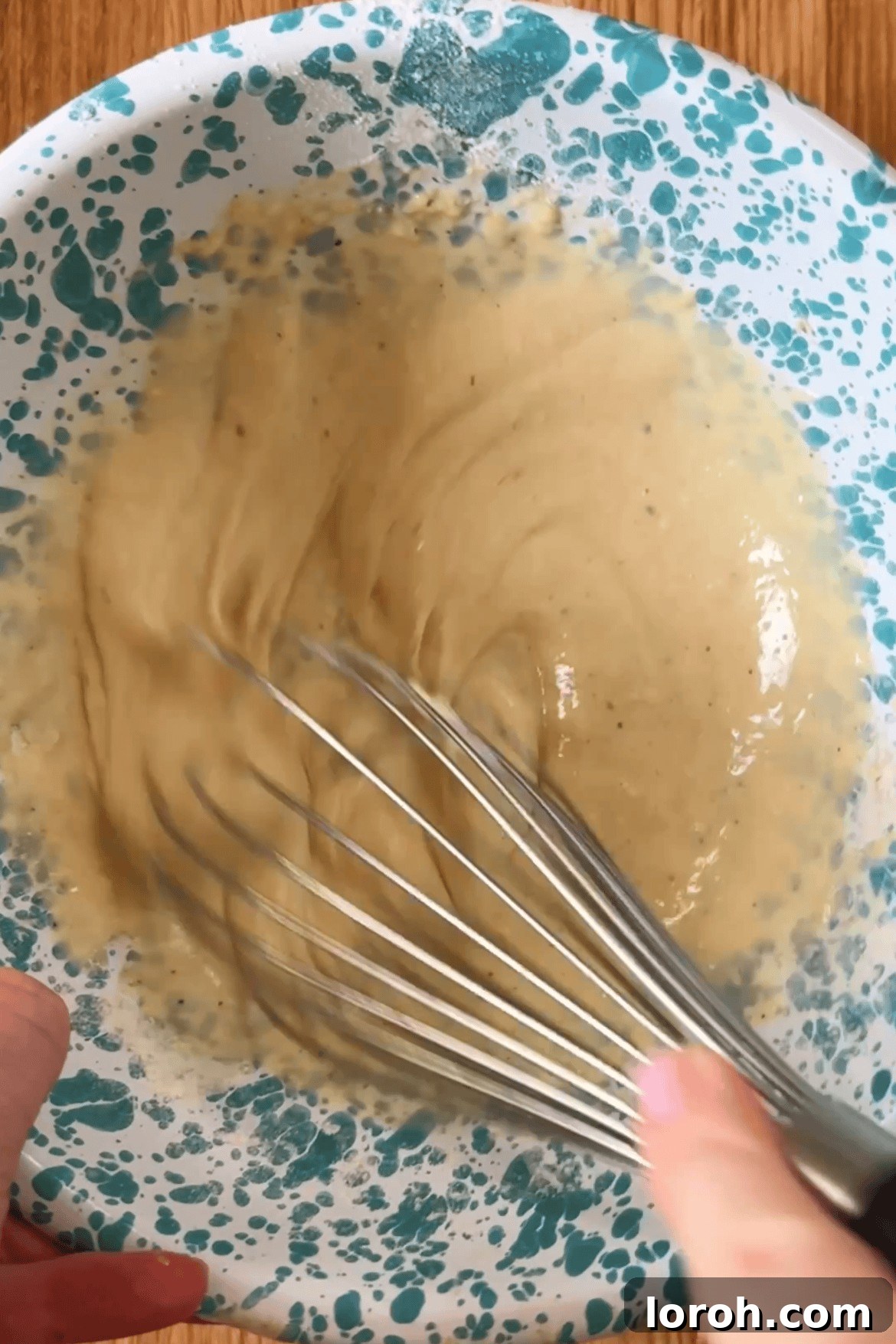 Mixing the batter ingredients in a bowl