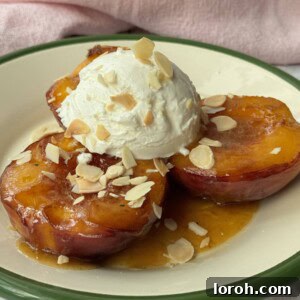 peaches and cream on a white plate with green trim