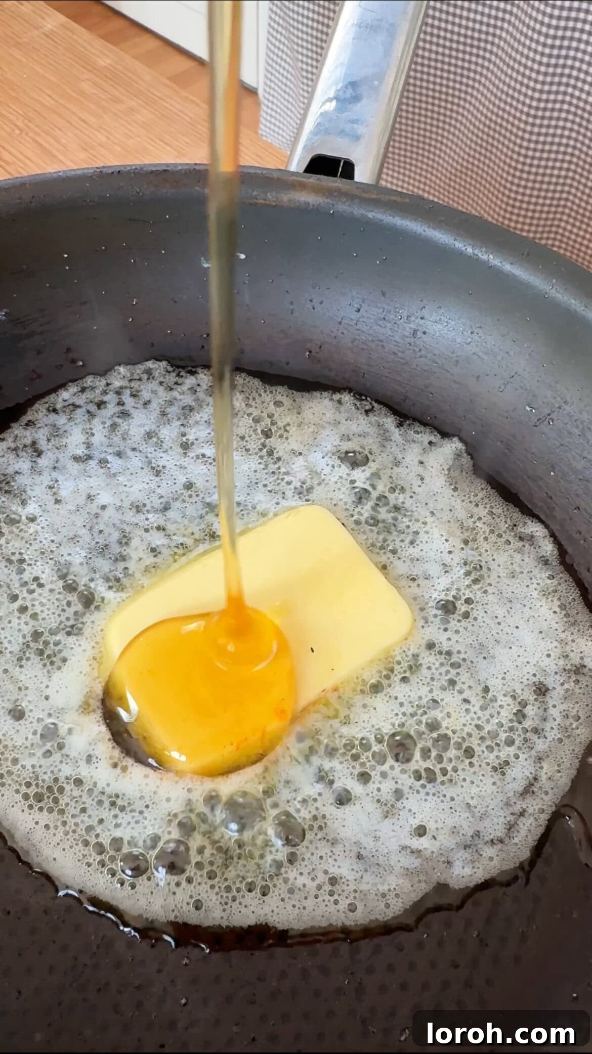 Melting butter, sugar, and honey to create the caramel for peaches and cream.