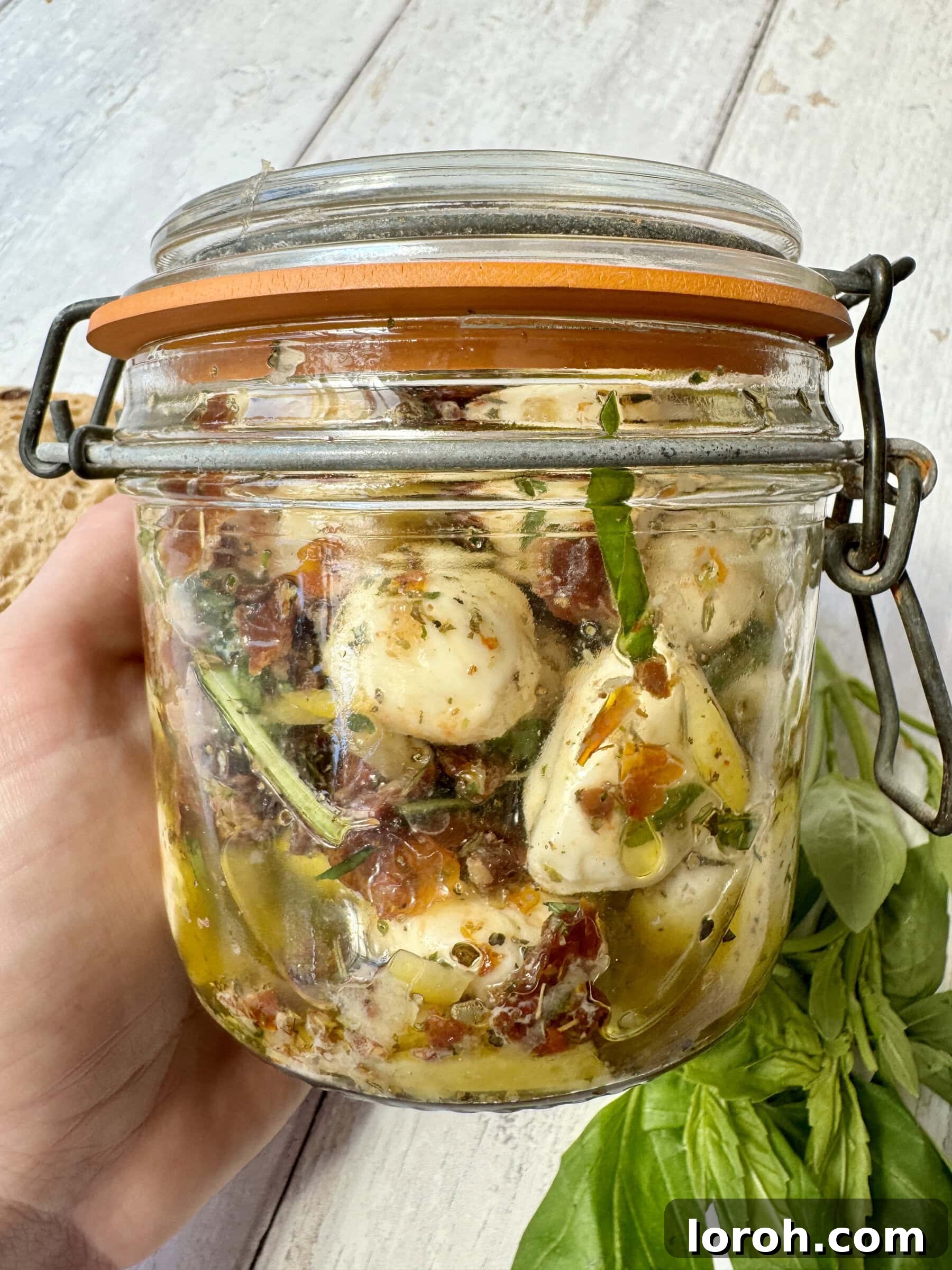 Marinated Mozzarella Bites 2 marinated mozzarella balls in a jar, ready to be served or stored