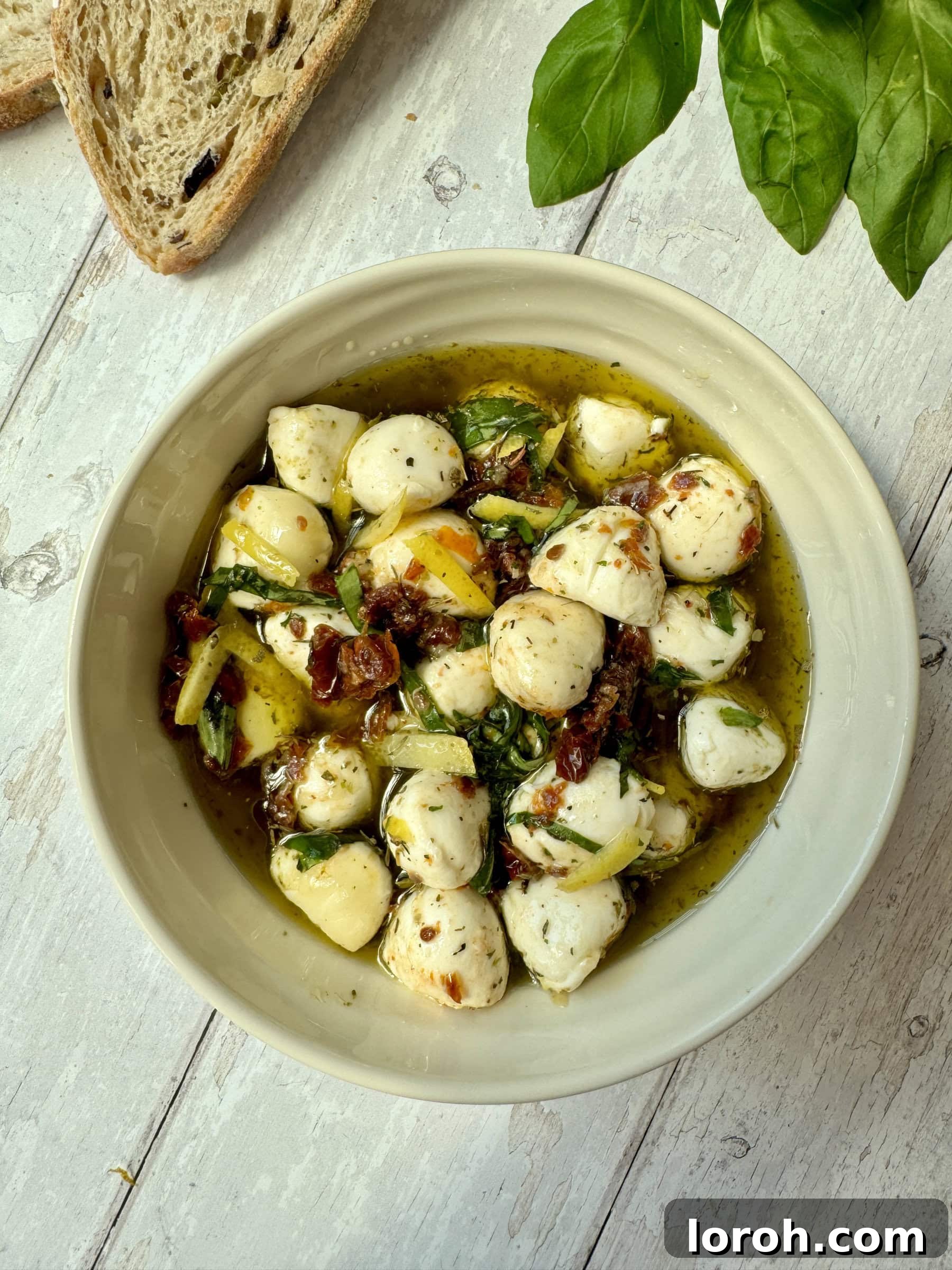 Marinated Mozzarella Bites 3 marinated mozzarella balls in a decorative bowl