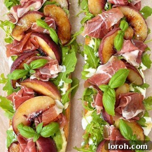 grilled peach and burrata salad on ciabatta. A top-down view of the assembled appetizer ready to serve, showing the full spread.