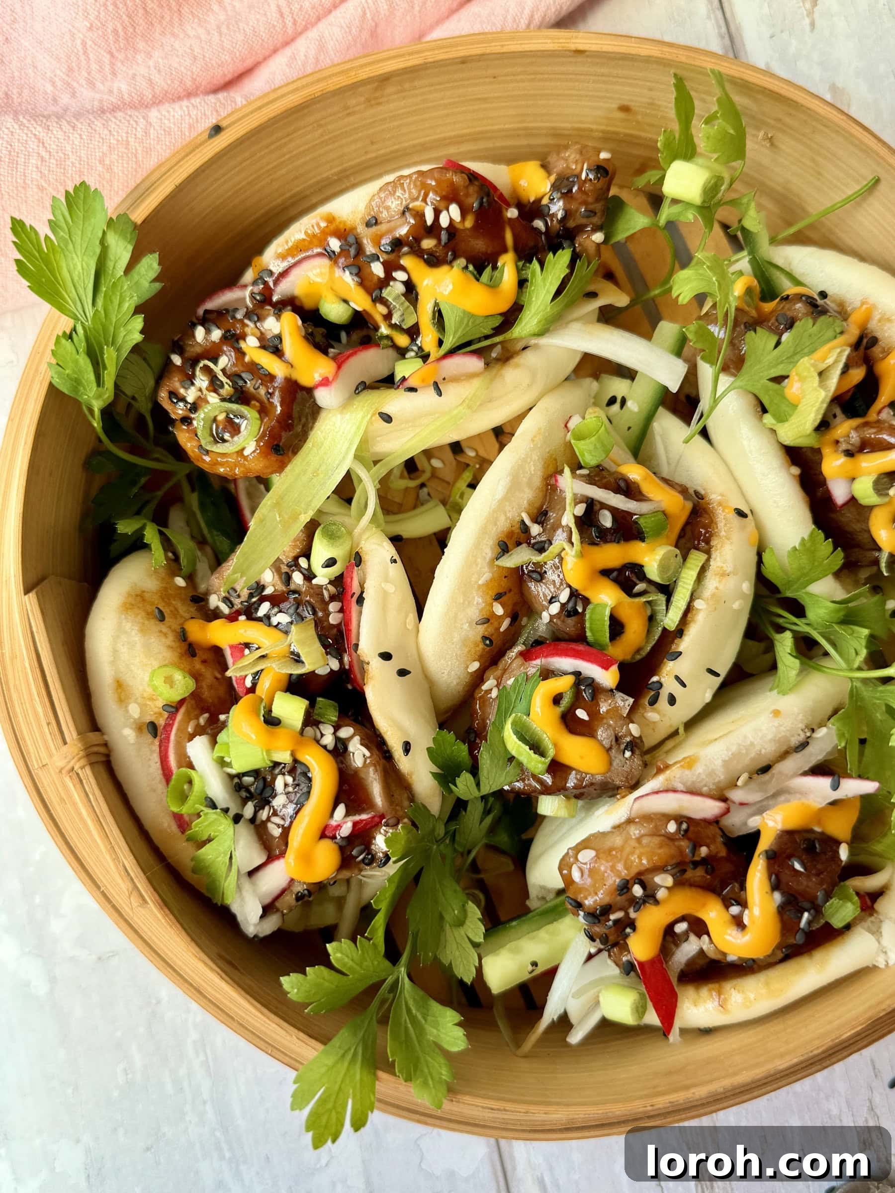 Peking Duck Bao Pockets 3 Close-up shot of a single duck bao bun, highlighting the succulent duck, vibrant toppings, and soft bun.