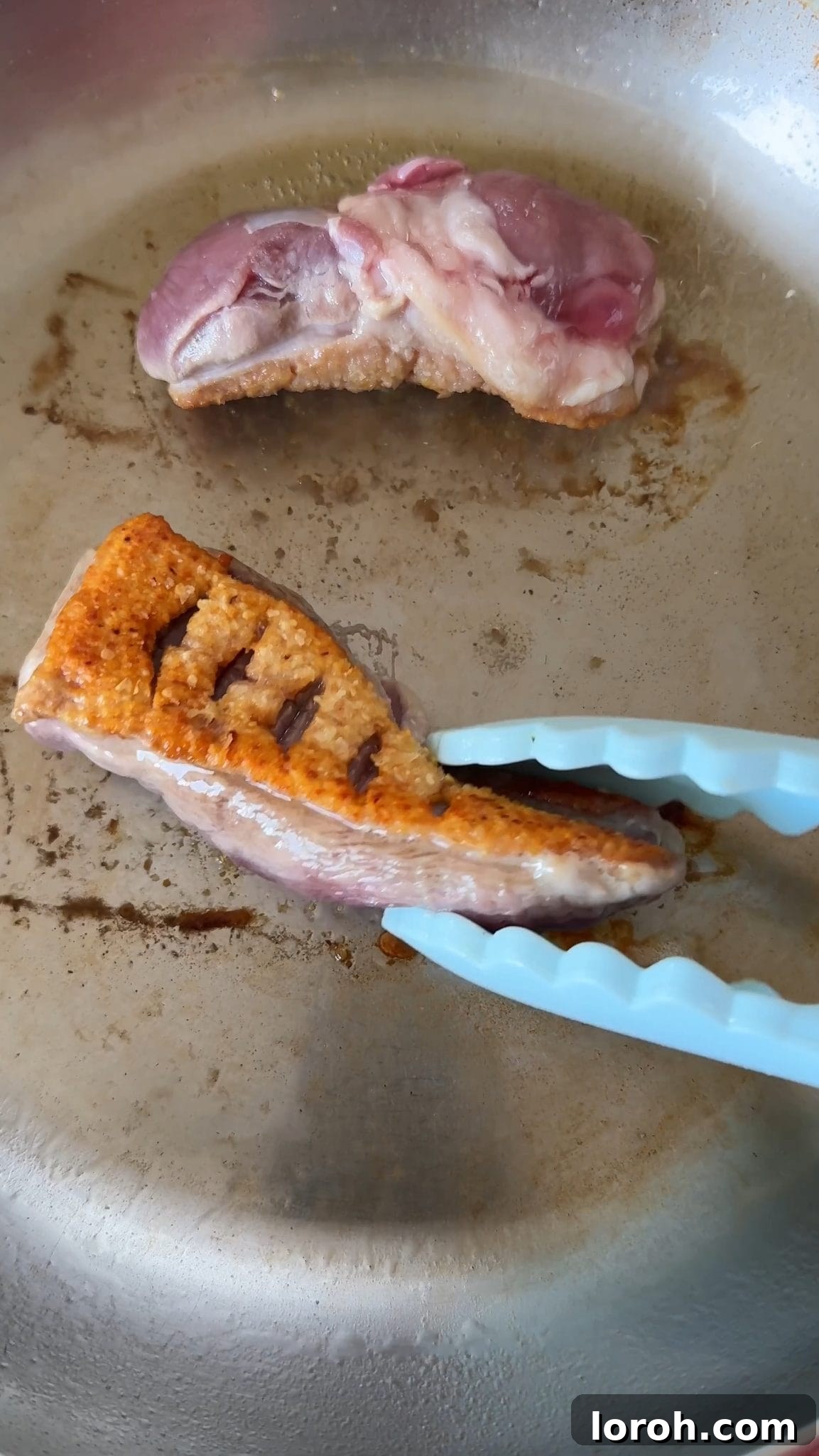 Peking Duck Bao Pockets 4 Step one: Duck breasts with scored skin frying in a pan.